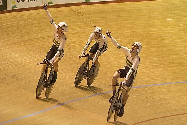 Australian Cameron Meyer, Rohan Dennis and Luke Durbridge begin their celebrations after winning the teams' pursuit final.