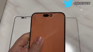 A screenshot of a video showing an iPhone 15 dummy with a Dynamic Island notch display