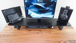 An overhead shot of all of the accessories I have on the Oakywood Desk Shelf on top of the Oakywood Standing Desk Pro