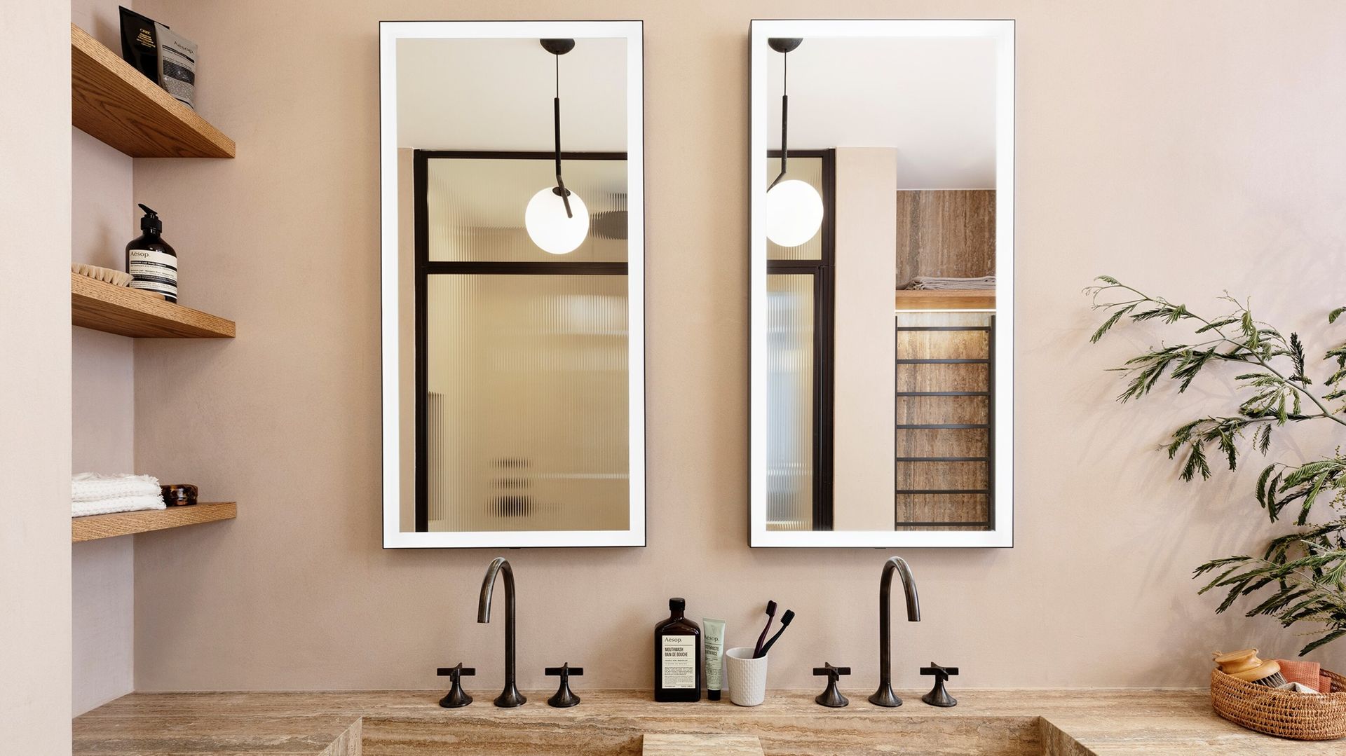 A neutral bathroom with shelves built into an alcove