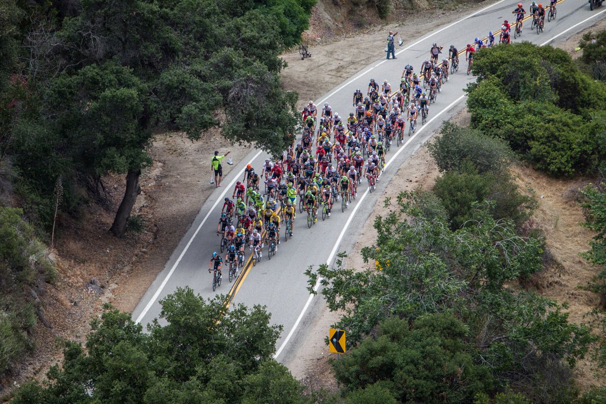 The peloton passes through the feed zone