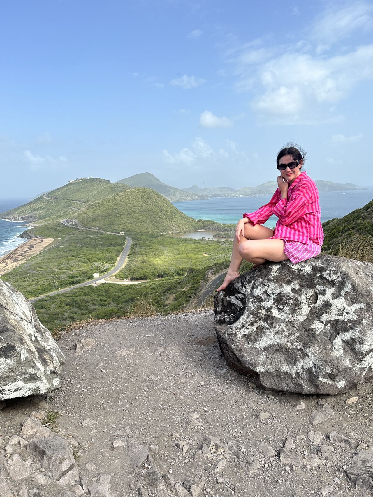 Mischa Anouk Smith at Timothy Hill Overlook, which overlooks the Atlantic Ocean to the left and the Caribbean Coast to the right