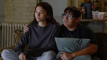 MJ and Ned sat on a couch in Spider-Man: Brand New Day