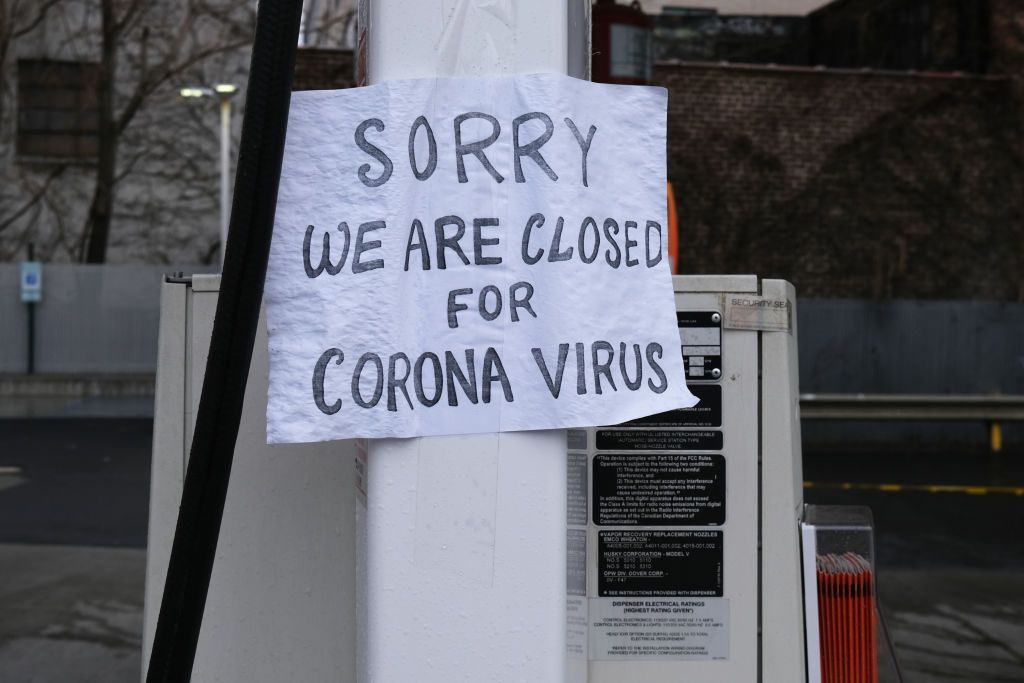 A business in New York with a closed sign.