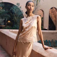 Woman in lace-trim silk top and skirt