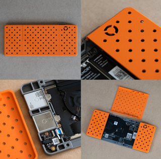 Orange 3D printed case for Framework mainboard