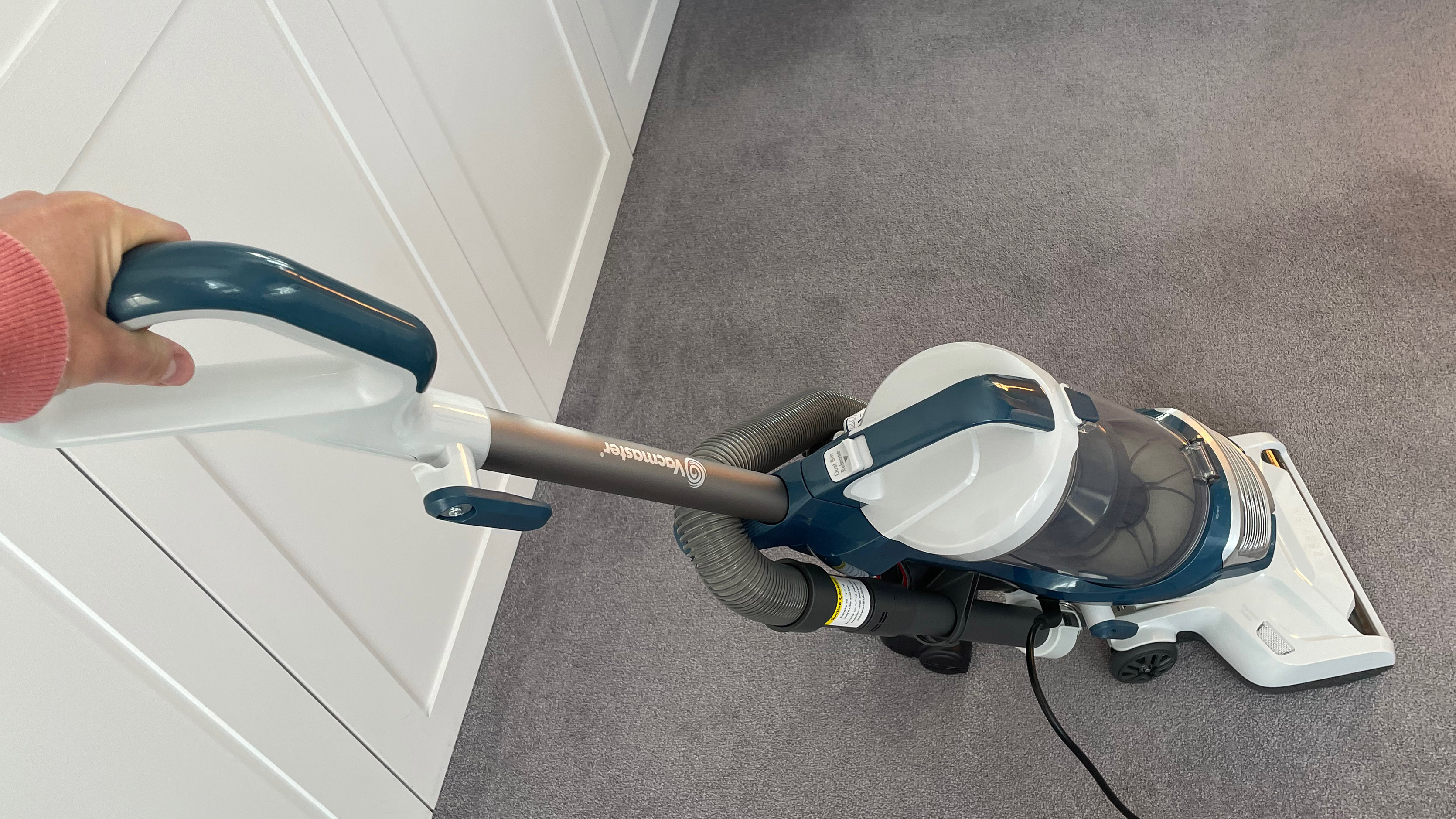 The Vacmaster Respira Pet Upright Vacuum UC0413EUK being used to cleaning carpet