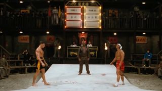 Two men stand opposite in an underground kung fu arena in Bloodsdport