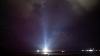 photo of illuminated rocket