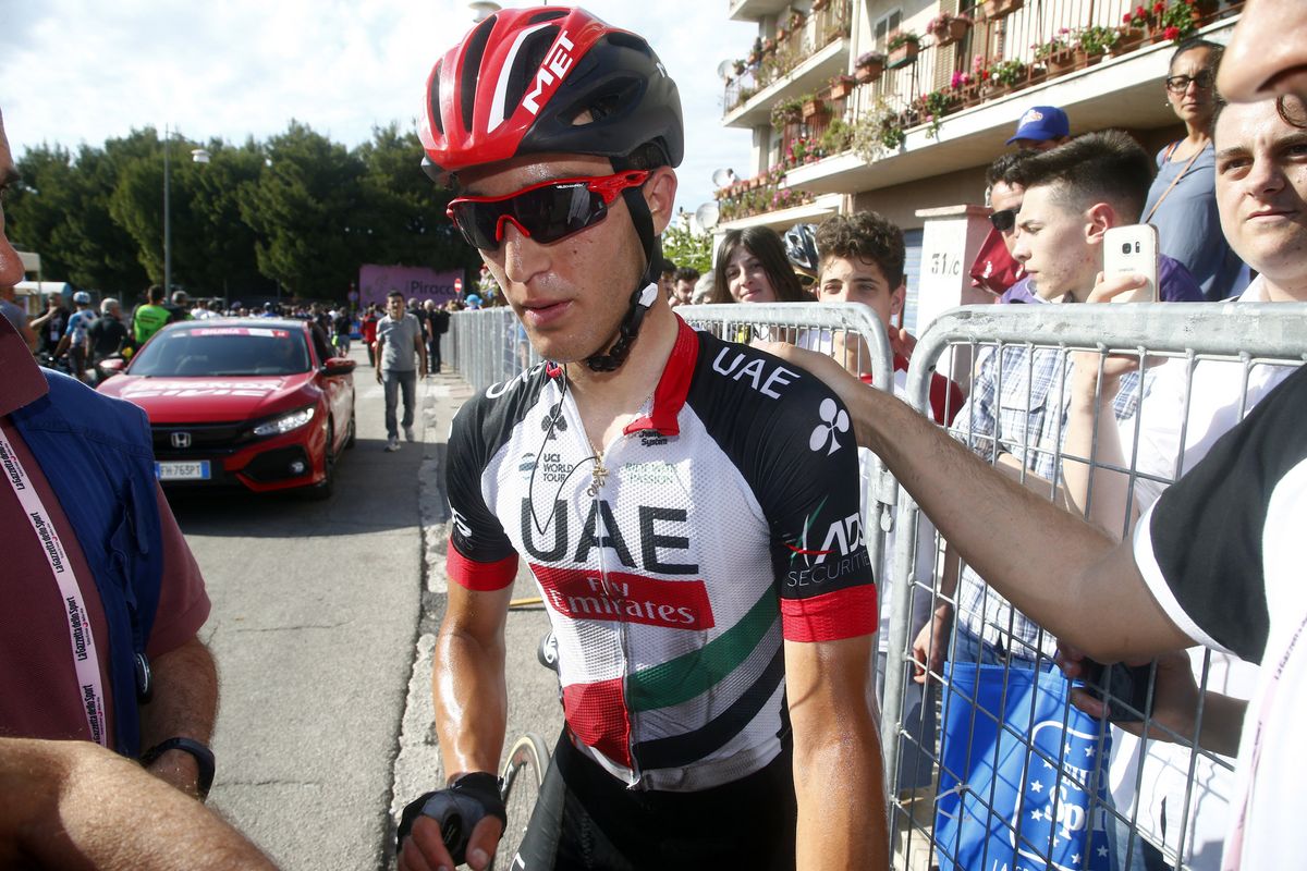 Valerio Conti (UAE Emirates) is consoled after hsi crash