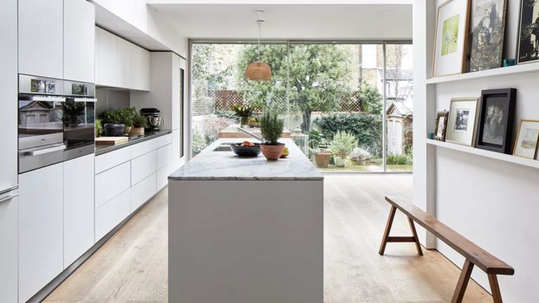 A bright kitchen with garden view