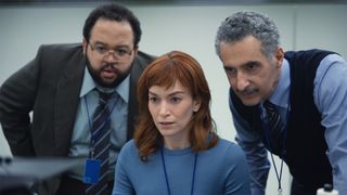 Severance stars Zack Cherry, Britt Lower and John Turturro looking at a computer screen