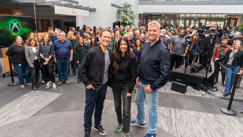 Phil Spencer, Asha Sharma, Matt Booty, and other Xbox employees at Microsoft pose for a photo.