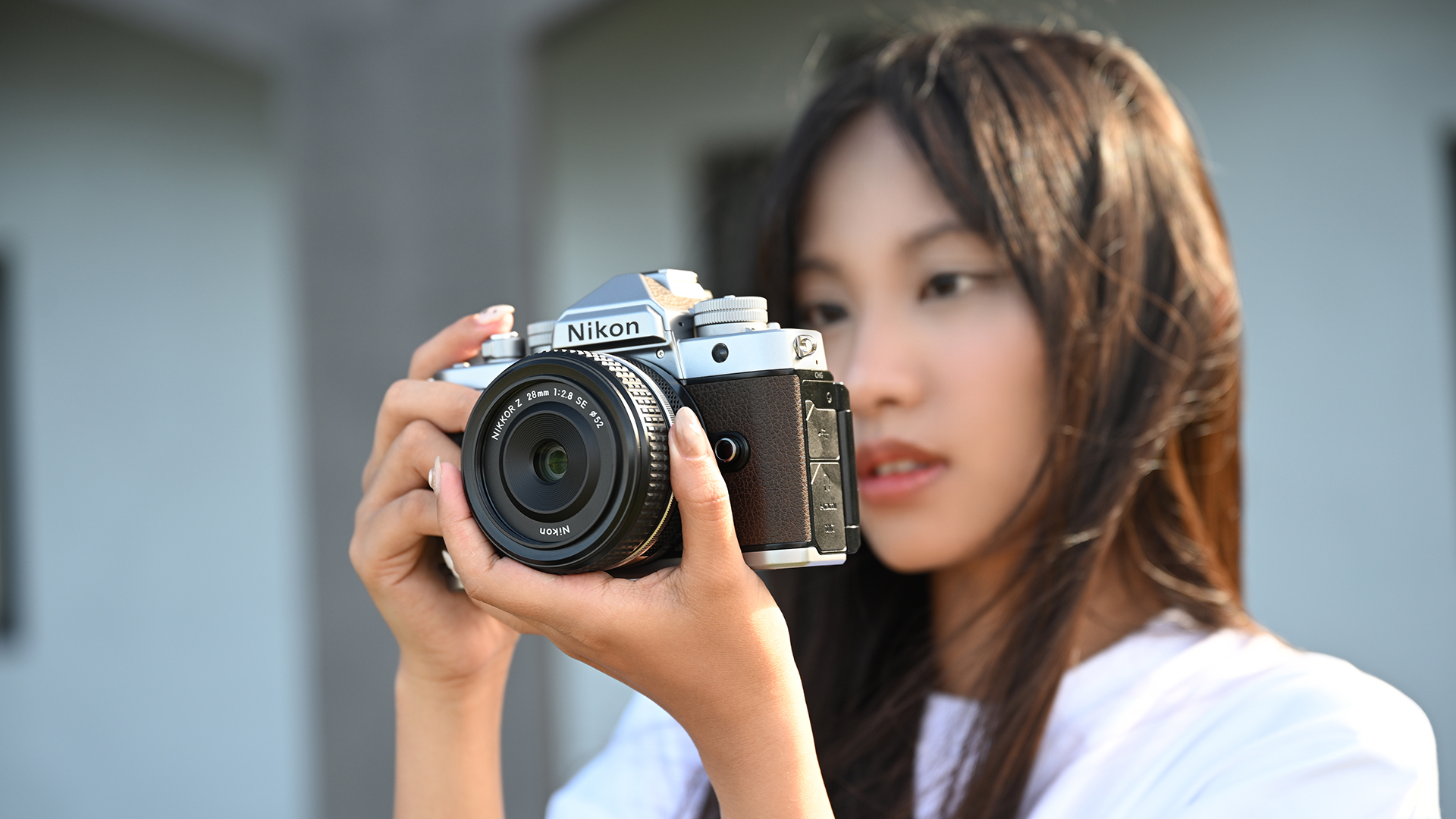 Woman holding Nikon Zf silver edition