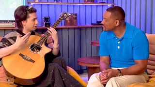 Marcin gives Will Smith a guitar lesson