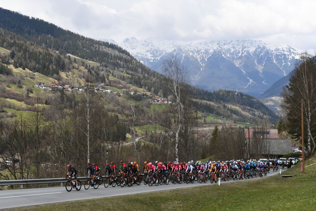 FEICHTEN IM KAUNERTAL AUSTRIA APRIL 20 Leonardo Basso of Italy Sebastian Henao Gomez of Colombia Ivan Ramiro Sosa Cuervo of Colombia Gianni Moscon of Italy and Team INEOS Grenadiers Green Leader Jersey Yukiya Arashiro of Japan and Team Bahrain Victorious Julius Van Den Berg of Netherlands and Team EF Education Nippo The Peloton passing through Unterleins Mountain 1058m during the 44th Tour of the Alps 2021 Stage 2 a 1215km stage from Innsbruck to Feichten im Kaunertal 1291m Landscape Snow TourofTheAlps TouroftheAlps on April 20 2021 in Feichten im Kaunertal Austria Photo by Tim de WaeleGetty Images