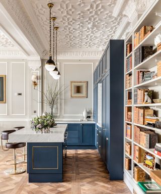 Blue kitchen with bookshelves