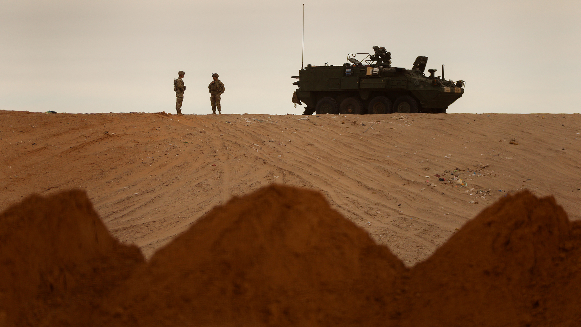 American servicemen guard the construction of a section of US-Mexico border wall near Santa Teresa, New Mexico