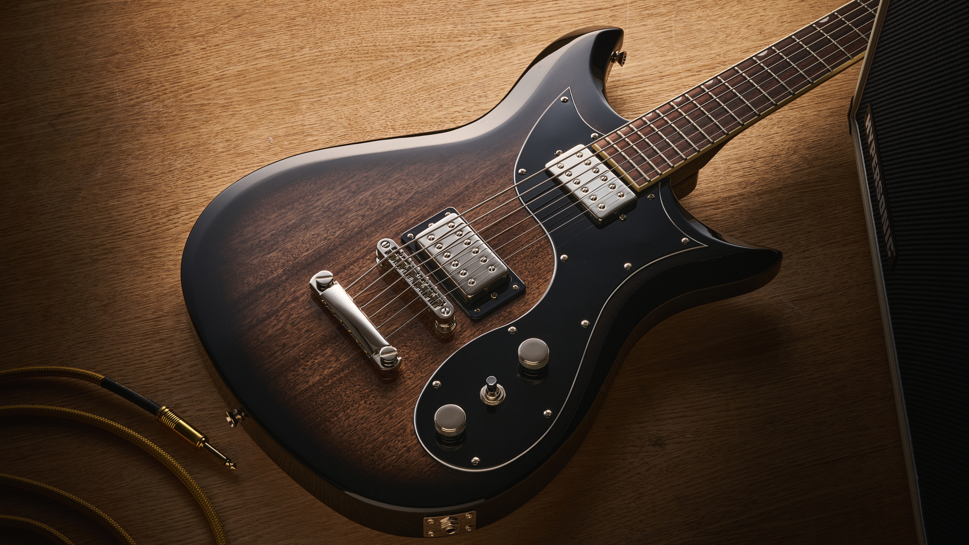 Gretsch Electromatic CVT Baritone in Bristol Fog brown sunburst finish shot on wood.