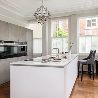 white kitchen with large central island