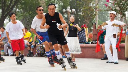 People rollerblading in a park in China