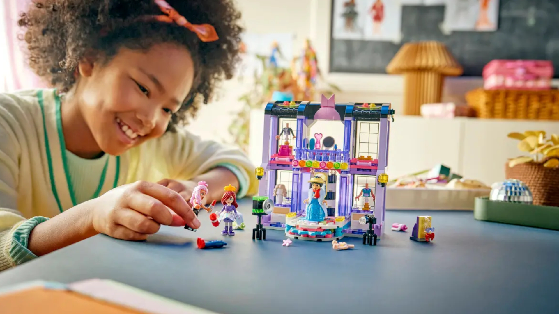A child plays with a Lego fashion show set