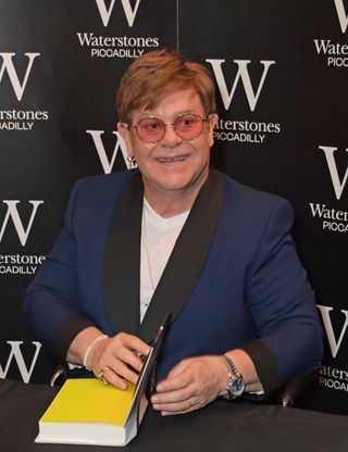 Elton John signs copies of his autobiography "Me"