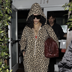 Rihanna steps out in a leopard print jumpsuit while carrying a Bottega Veneta bag as she's seen leaving Italian restaurant Giorgio Baldi after having dinner on Halloween Eve in Santa Monica. She wore a leopard onesie and a woven bottega veneta bag.