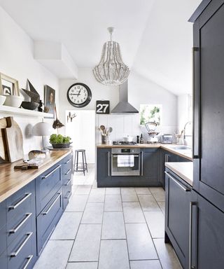 kitchen room with white wall and wall clock