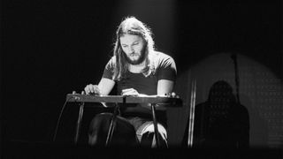 David Gilmour of Pink Floyd performs on stage at Ahoy in Rotterdam, Netherlands in February 1977 during the Animals tour. He is playing a Jedson lap steel guitar.