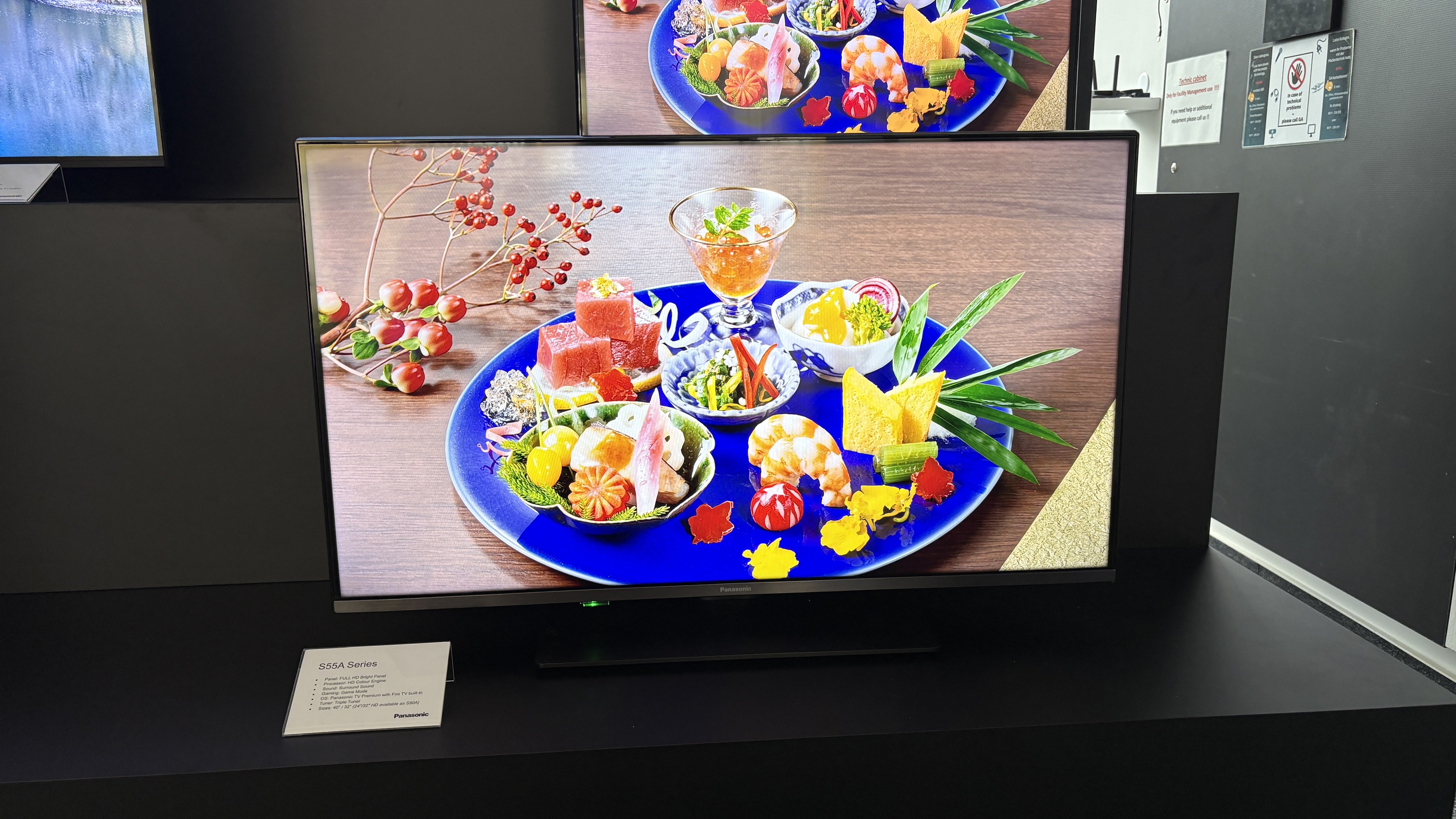 Panasonic TVs on a black show stand