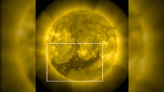 A photo of the sun with a large dark "hole" in its southern hemisphere