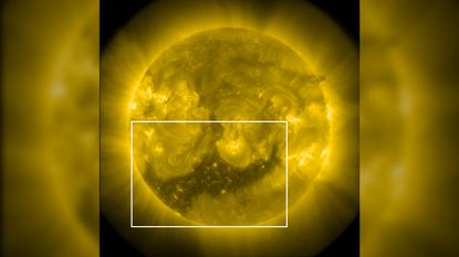A photo of the sun with a large dark "hole" in its southern hemisphere