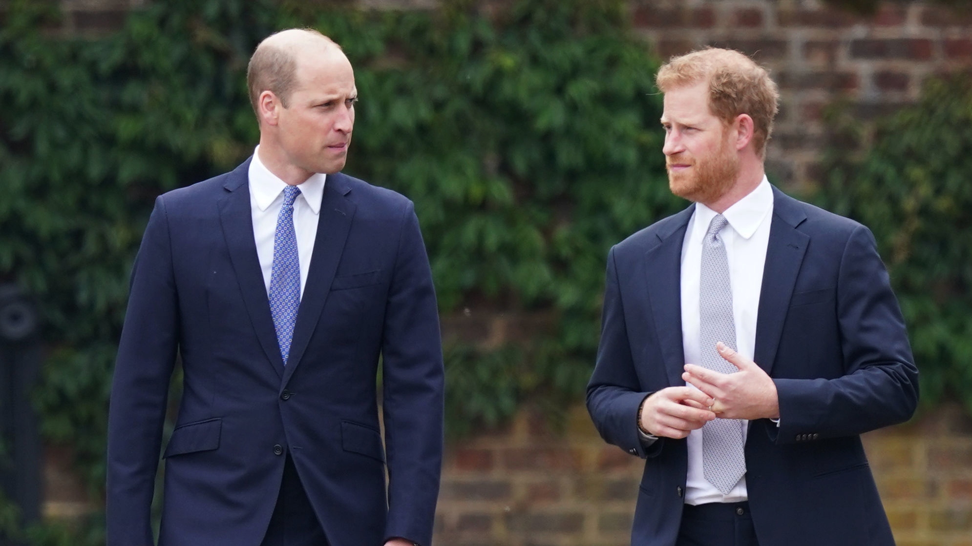 Prince William and Prince Harry, Duke of Sussex arrive for the unveiling of a statue they commissioned of Diana, Princess of Wales, in the Sunken Garden at Kensington Palace
