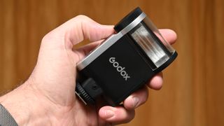 Godox iA32 product image, held in hand