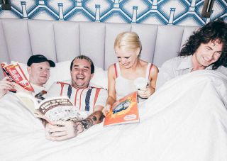 A photo of Amyl And The Sniffers all together in a white bed