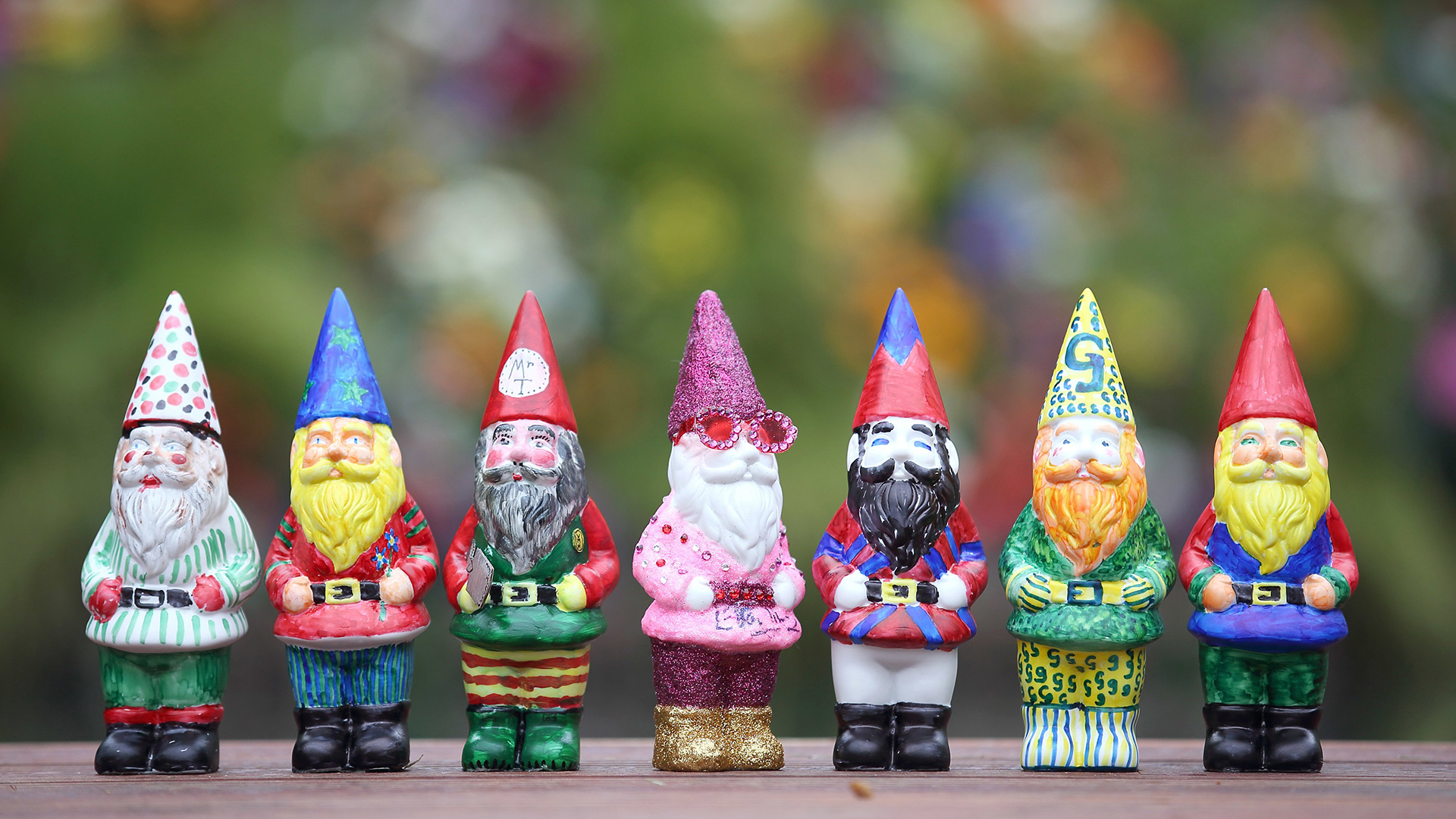 A row of painted gnomes decorated by celebrities to raise money at the RHS Chelsea Flower Show 2013