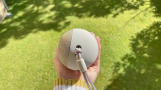 Beats Pill speaker outside on a sunny day