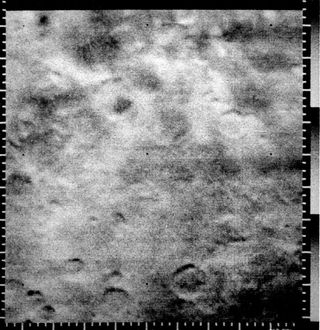 This Mariner 4 image was the first picture showing unambiguous craters on the surface of Mars. The area, 262 by 310 km (162 by 192 miles), is a heavily cratered region south of Amazonis Planitia.