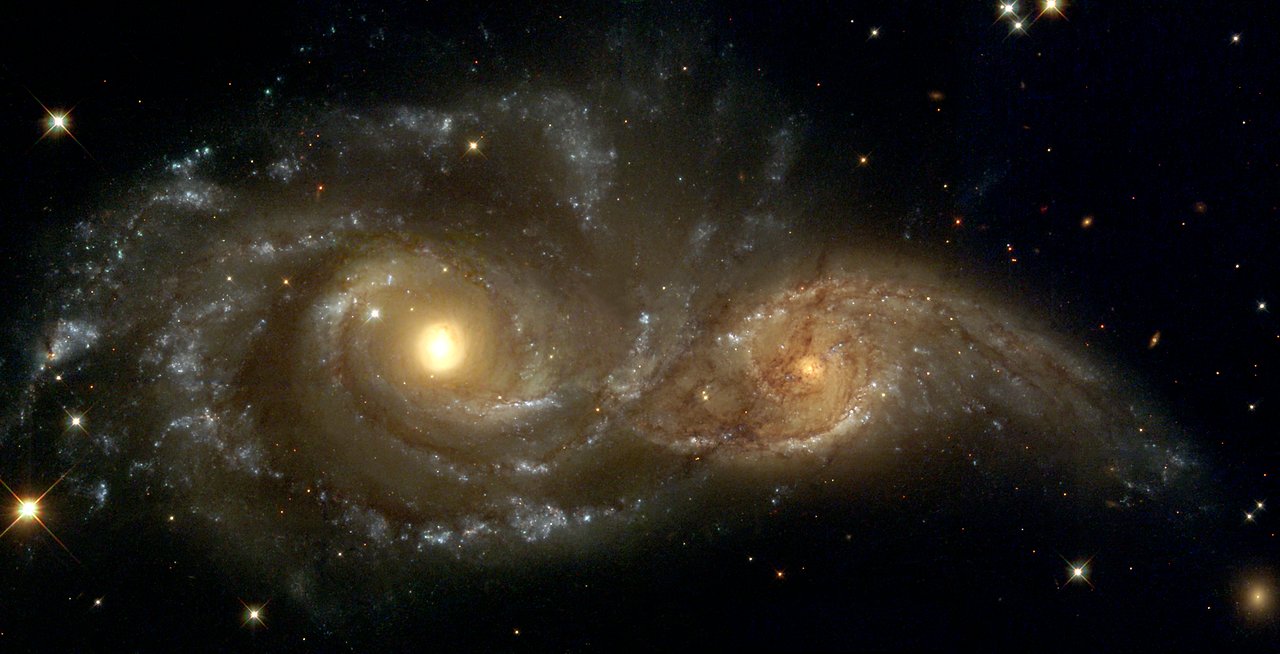 A photo showing two galaxies appearing to interact in space