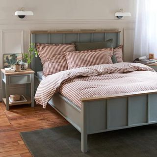 Grey wooden bed frame in neutral bedroom