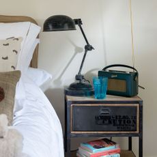 Bedroom with vintage radio on a bedside table 