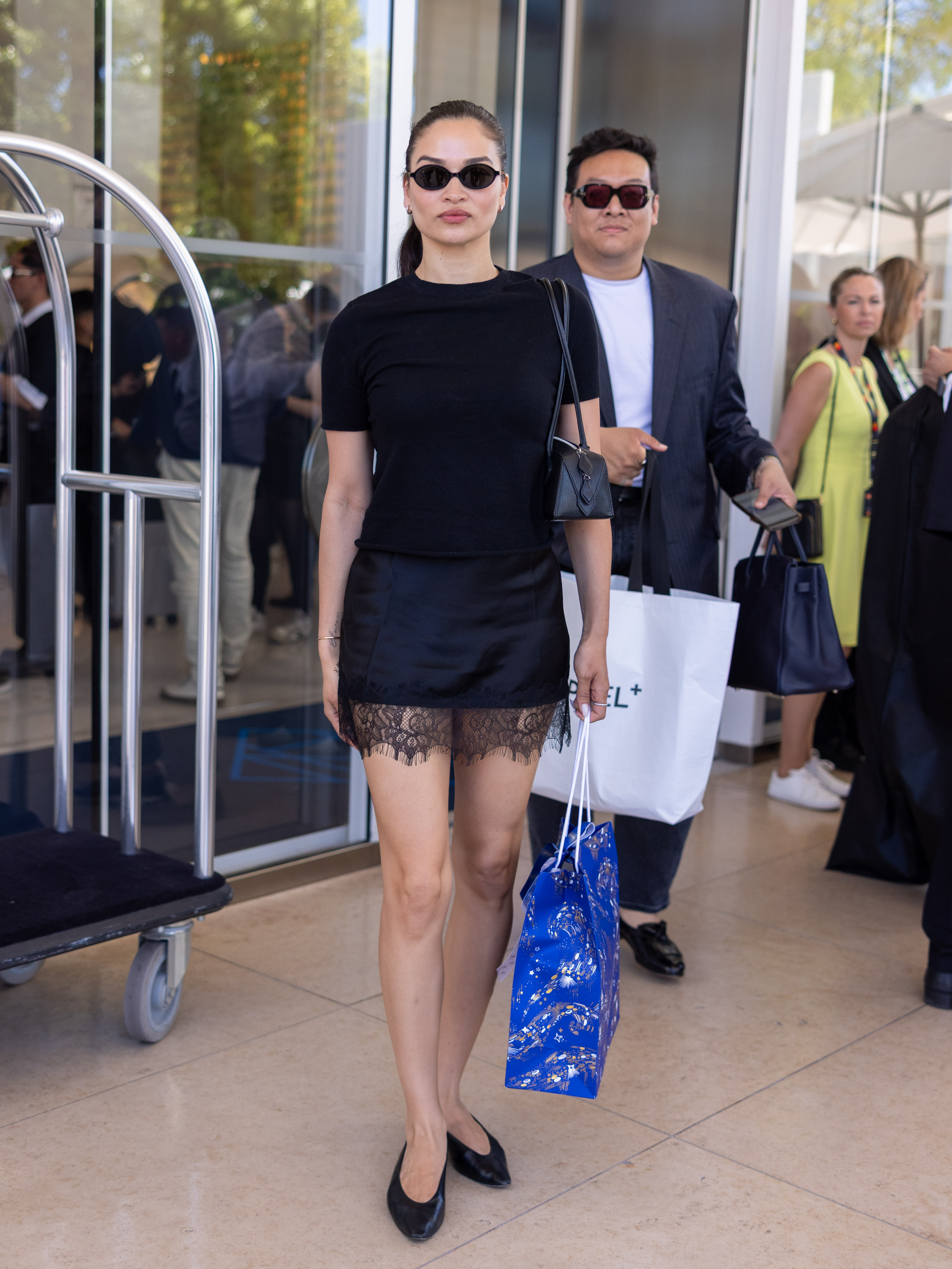 Influencer wears a lace trimmed skirt.