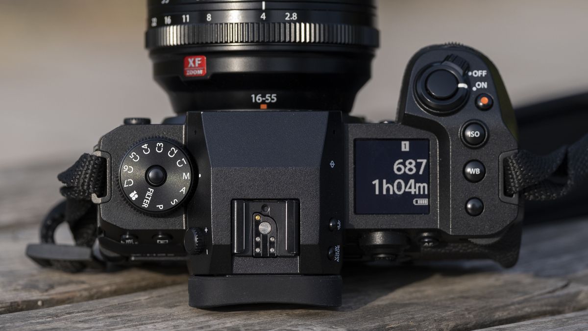 The Fujifilm X-H2S camera sitting on a wooden bench