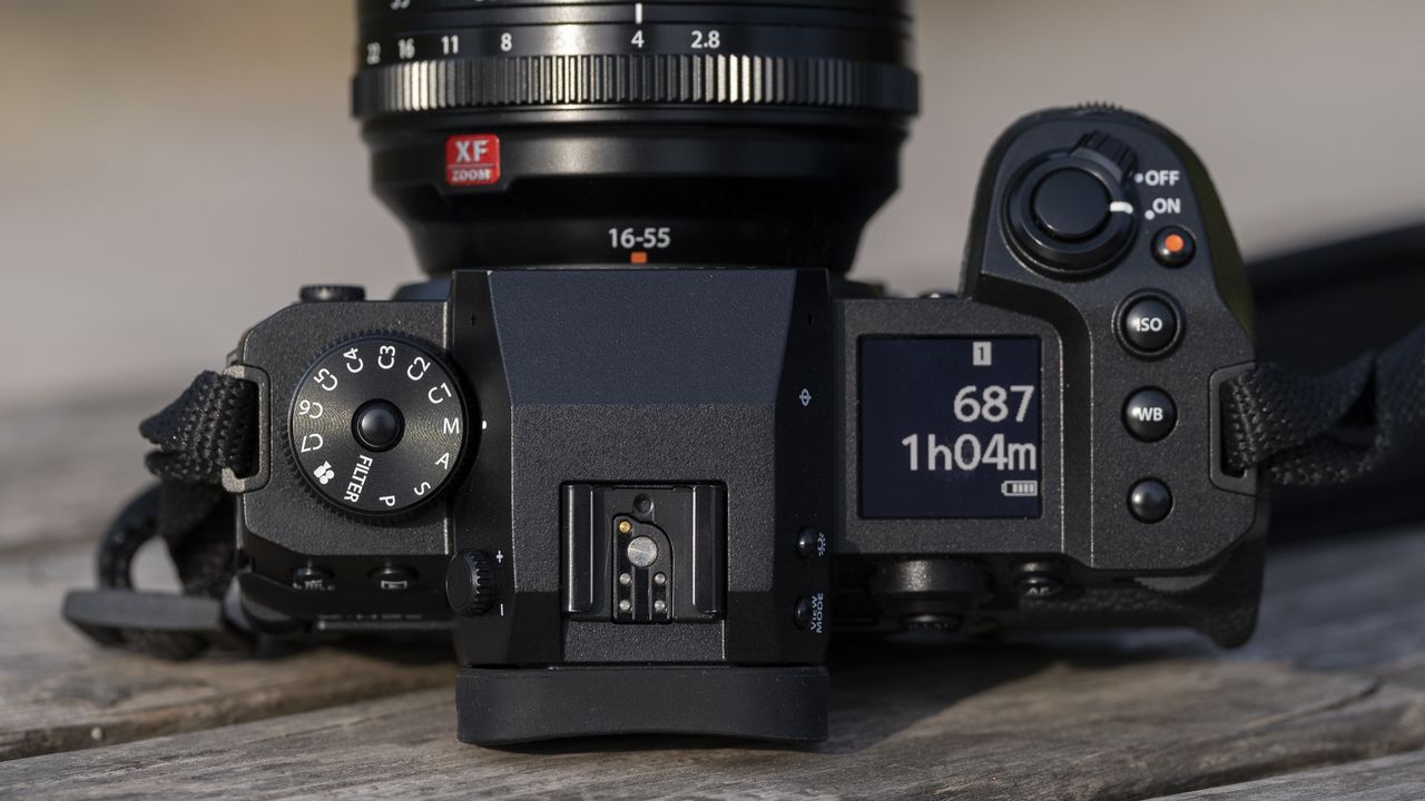 The Fujifilm X-H2S camera sitting on a wooden bench