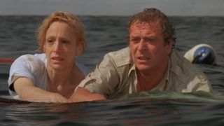 Lorraine Gary and Michael Caine floating together on some wreckage in Jaws: The Revenge.