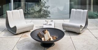 contemporary balcony with fire pit to show the quiet luxury garden trend