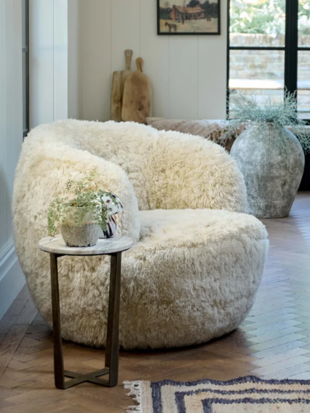 A sheepskin swivel armchair from Abigail Ahern