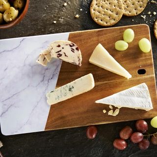 wooden chopping board with biscuits and grapes