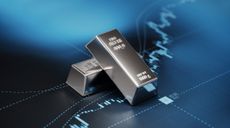 Silver Bars Sitting on Blue Bar Graph